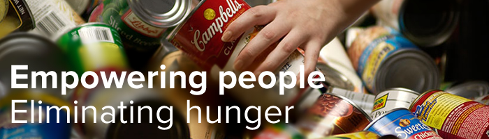 photo of cans of food with text: empowering people, eliminating hunger